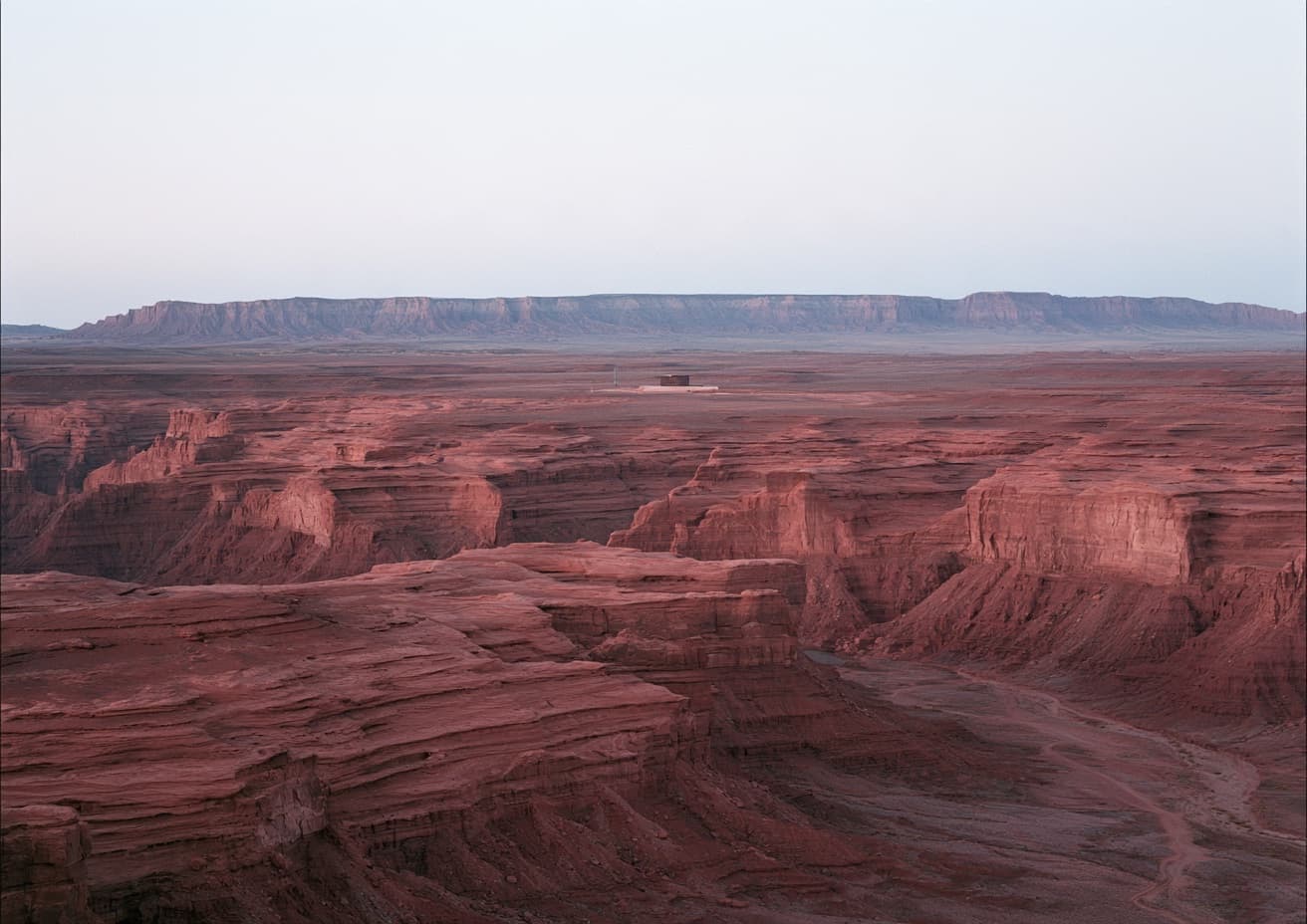 A broad red desert canyon